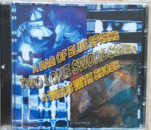 Two Lone Swordsmen - A Bag Of Blue Sparks / A Virus With Shoes (1999)